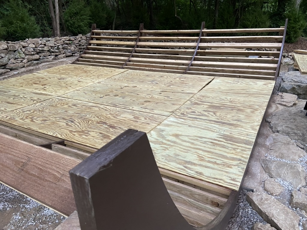 Mini ramp framed with ribs and partially layered