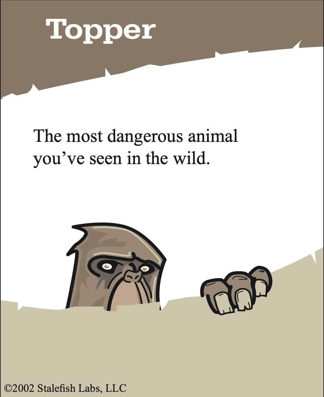 A Topper prompt in the wild: answer big enough to win, believable enough to survive a challenge. A Topper prompt card reading “The most dangerous animal you’ve seen in the wild,” with a cartoon creature peeking over a dune
